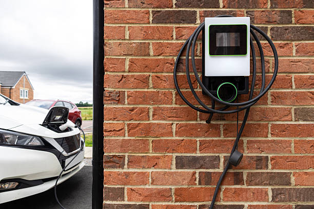 Electrician installing a residential EV charging station in Marco Island, FL